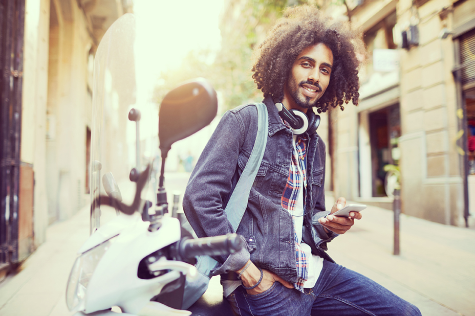 Young trendy man in Barcelona. Business on the go, technology, millennials lifestyle.